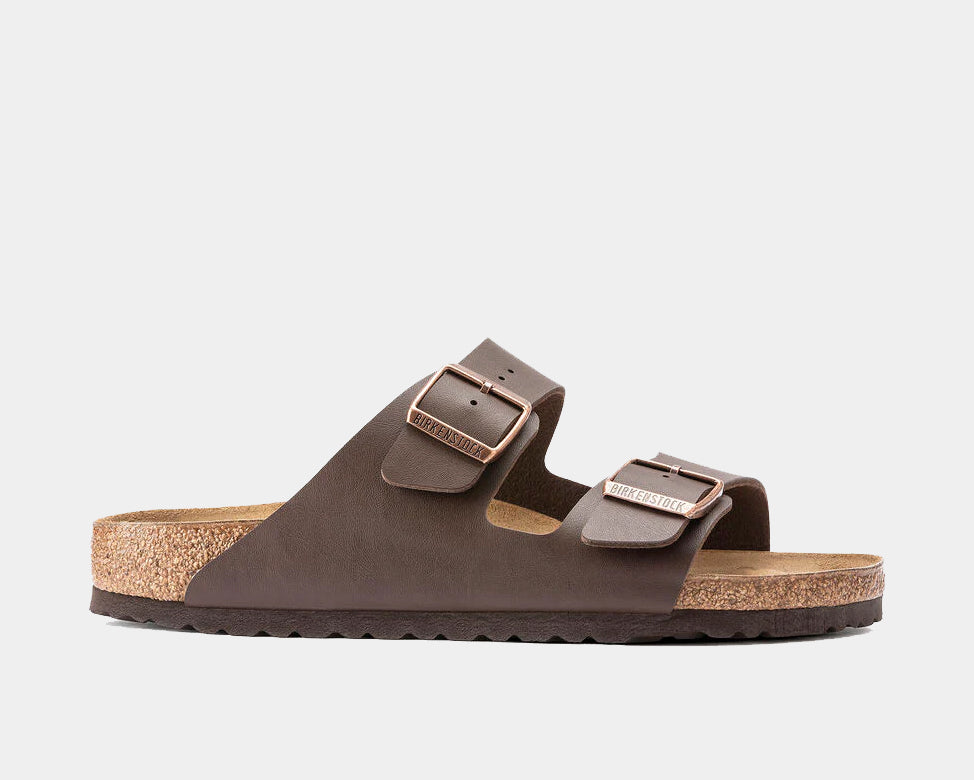 A pair of Birkenstock Arizona Birko-Flor sandals in dark brown color with two adjustable straps and metal pin buckles.