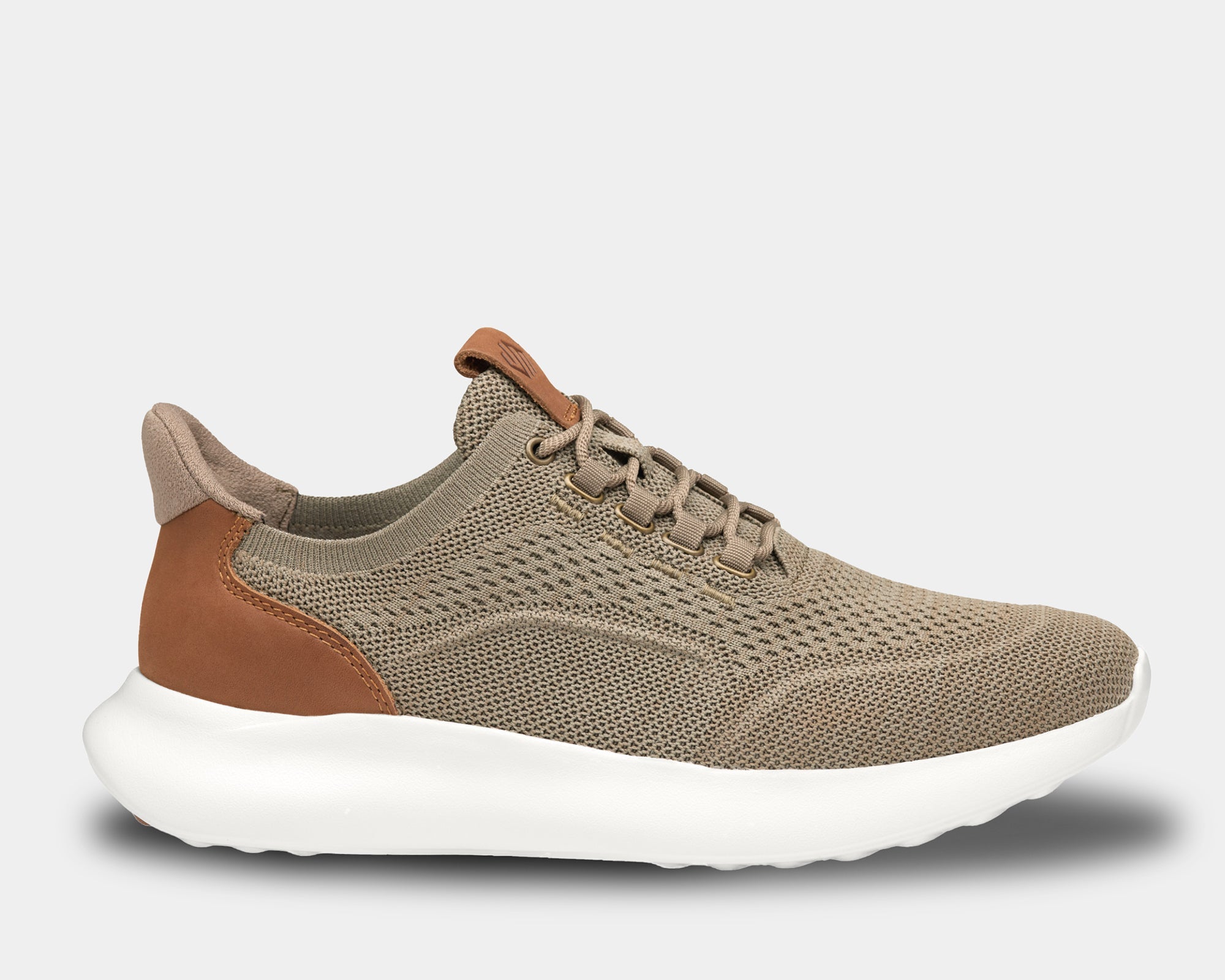 A pair of low-top athletic style knit sneakers with a plain toe design, featuring a taupe heathered knit fabric, brown leather trim, and a tan heel counter.